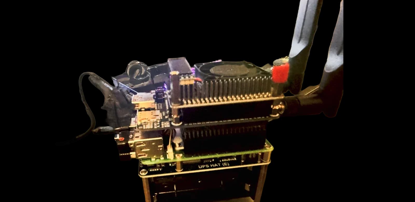 BadBrik board stack with cooling fan, expansion boards, and power layer